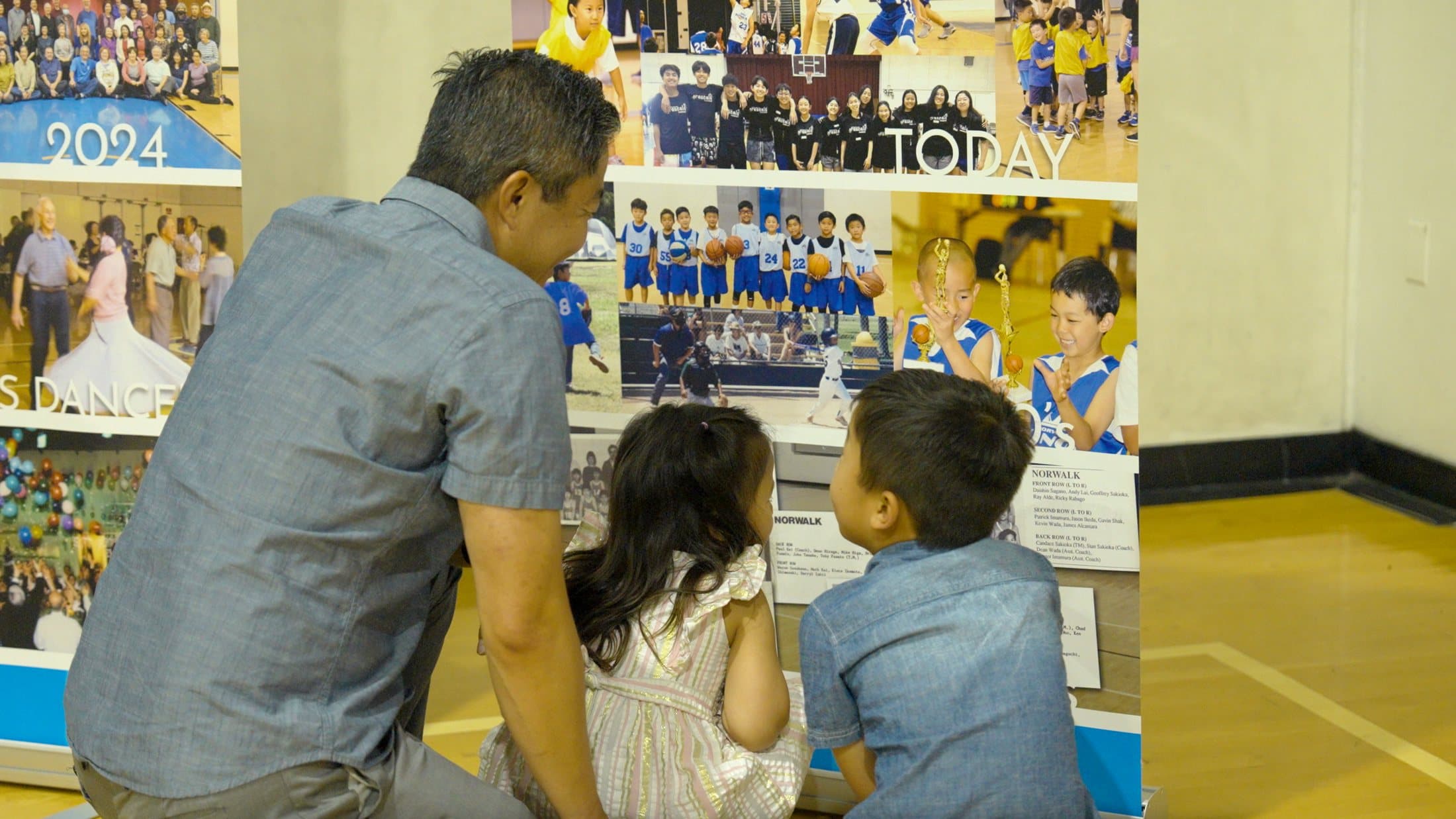 Visitors looking through the group history displays at the 100th anniversary celebration