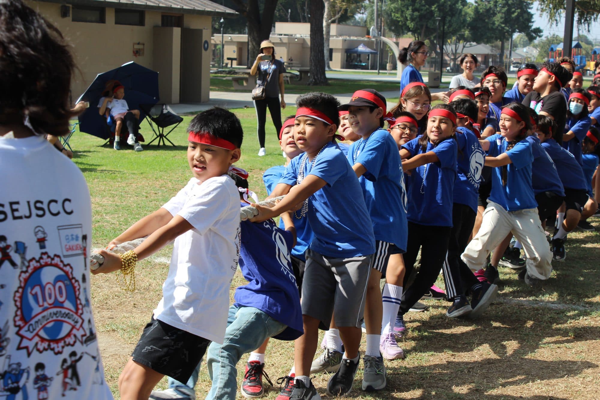 Students racing across the field at the school's annual undokai