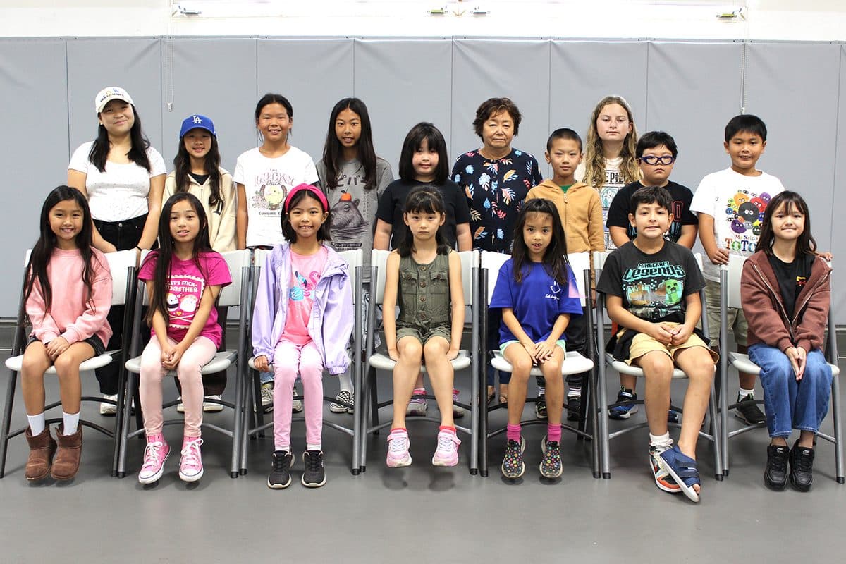 Elementary level students with their teacher