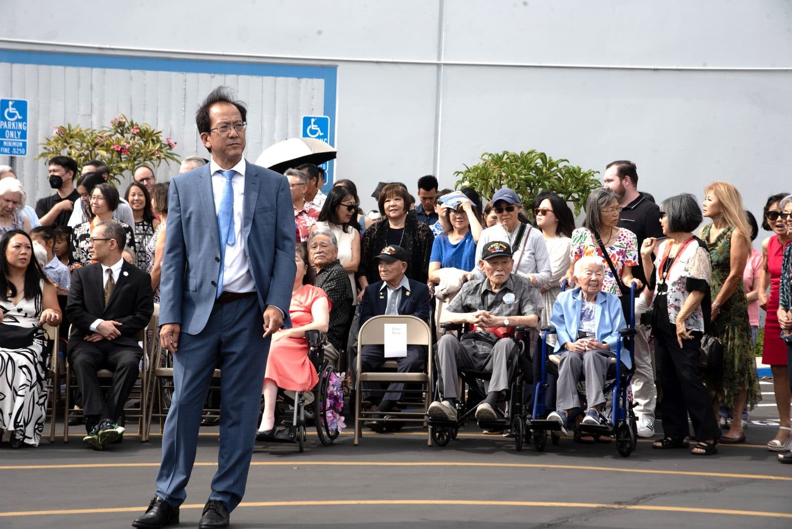 A large crowd gathered outside the center for the group photo