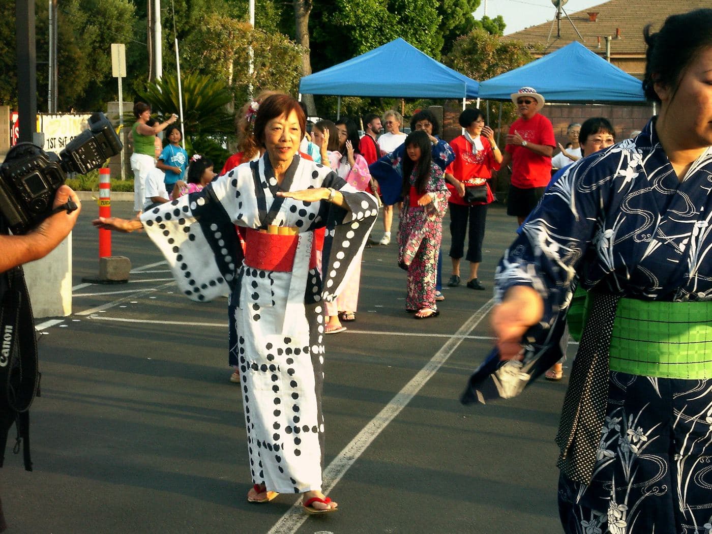 Dancers in yukata circling the parking lot for the festival's bon odori